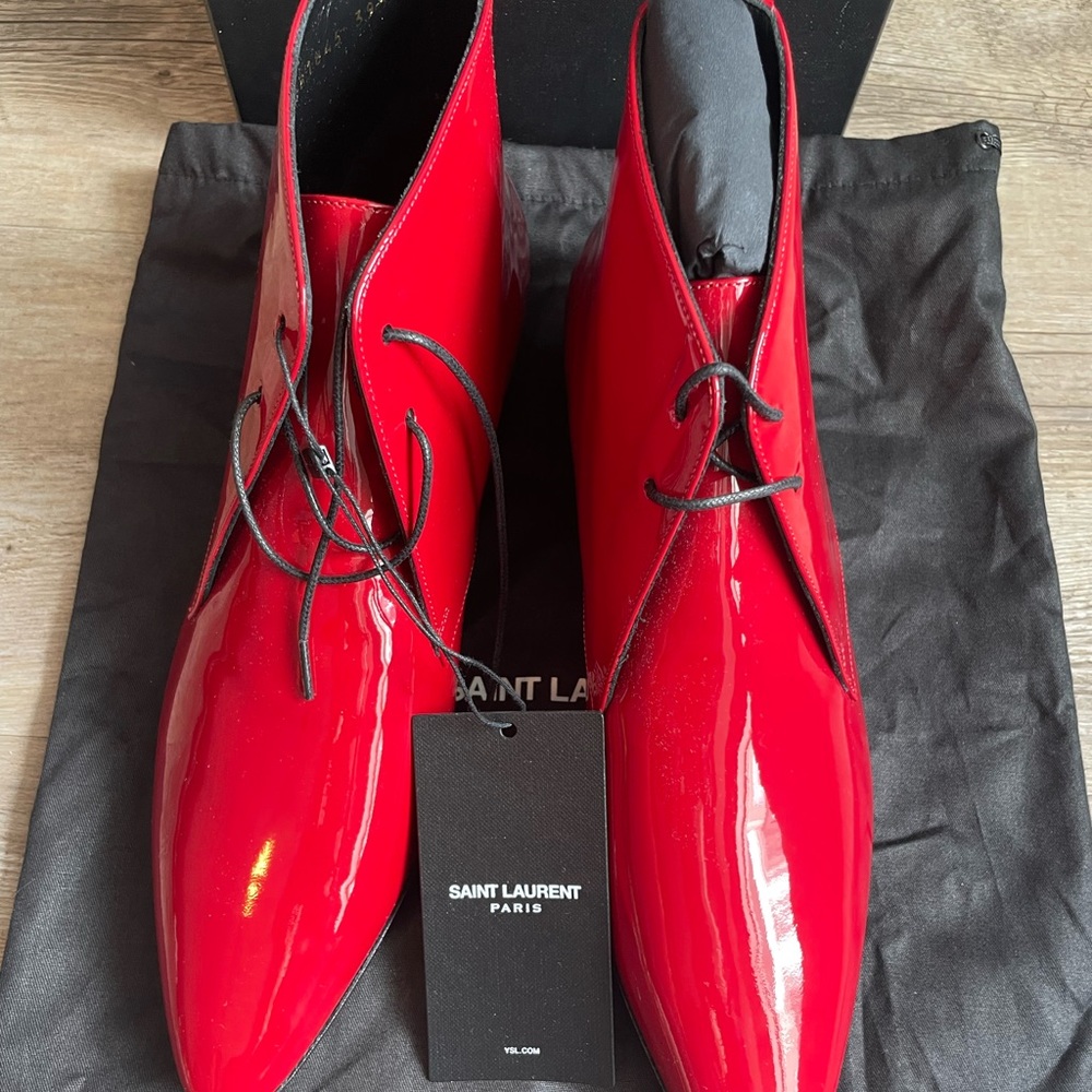 SAINT LAURENT JONAS 25 LACED ANKLE BOOTS WITH STACKED HEEL AND POINTED CUT-OUTS